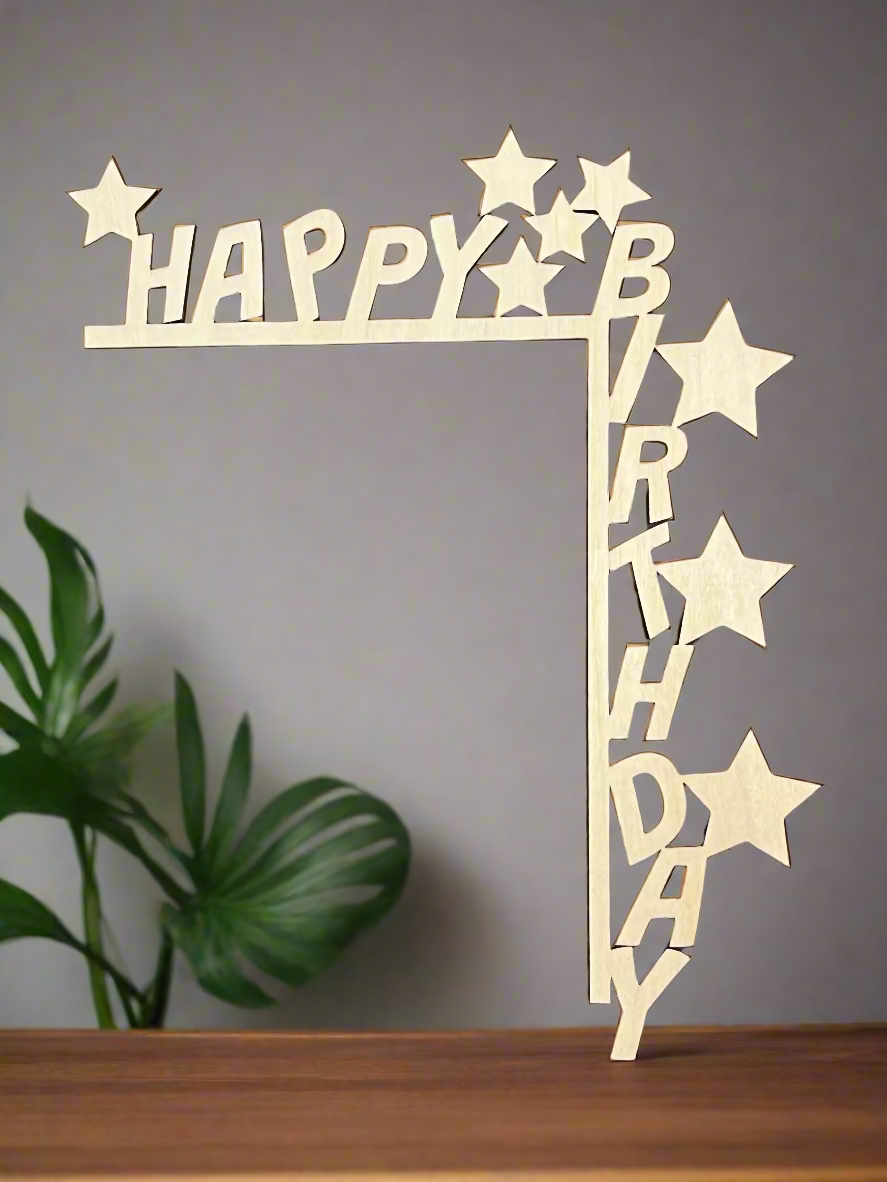 Wooden 'Happy Birthday' decoration with stars on a brown background
